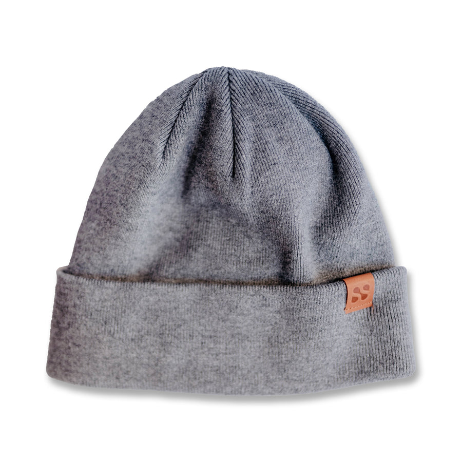 Gray beanie hat with a fold-over cuff and a small leather patch, designed to block RF radiation for safety.