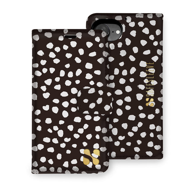SafeSleeve detachable case for iPhone 16 series featuring a black and white spotted design with gold accents.